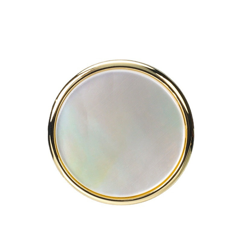 Natural shell button with gold metal base and shank