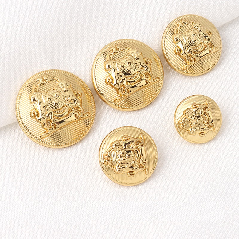 Set of gold round metal shank buttons with lion crest engraving