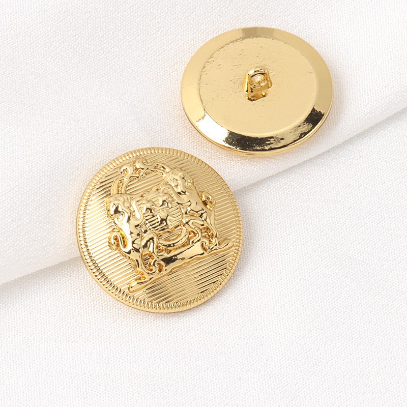 Gold metal shank button front and back, round lion crest design