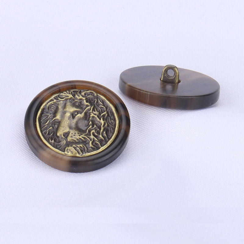 Lion head resin button with loop shank, dark brown back and gold emblem front