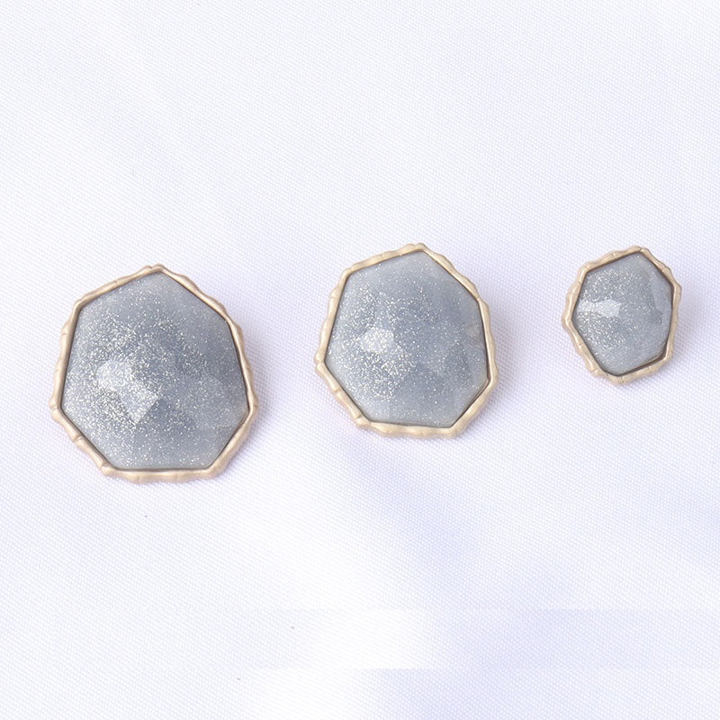 Blue octagonal shank buttons set, textured front faces with metal rim