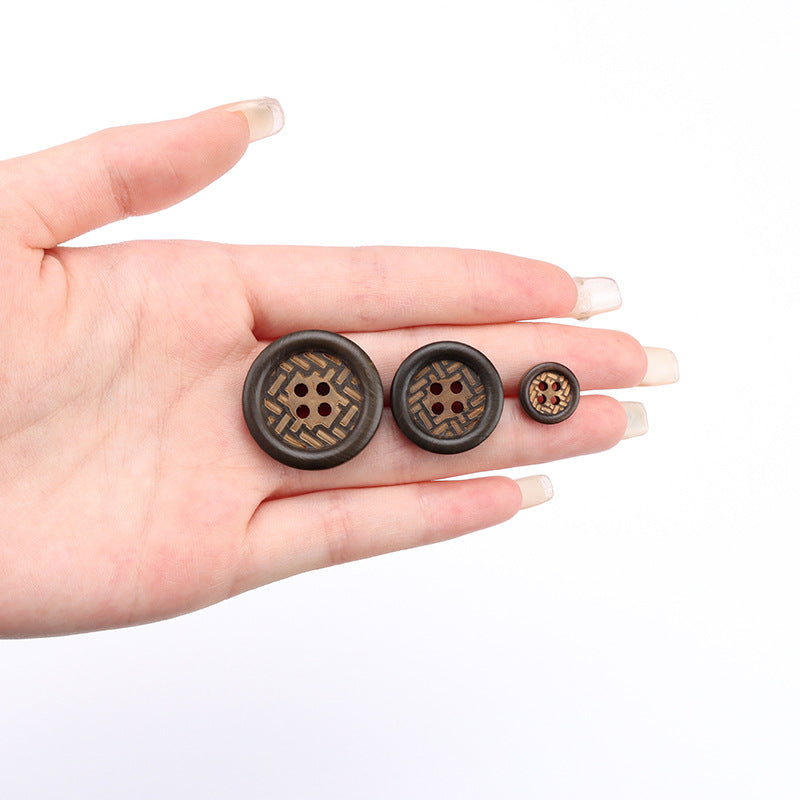 Set of dark brown 4-hole wood buttons in hand, with small button close-up