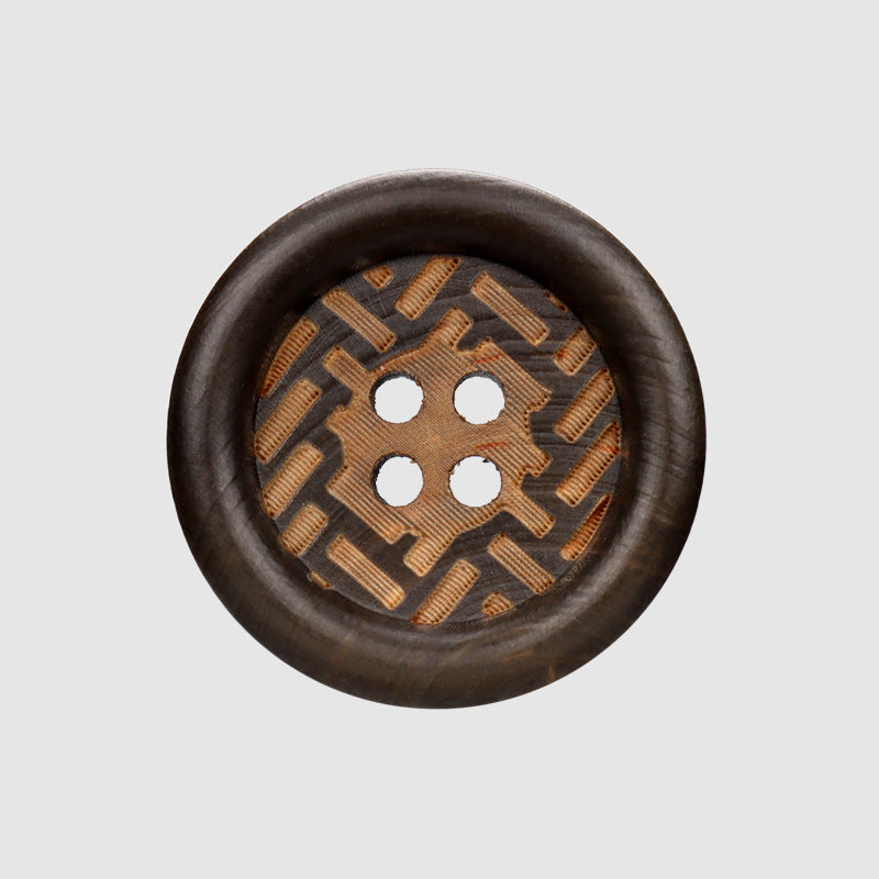 Dark brown round wooden 4-hole button with laser-engraved geometric cross