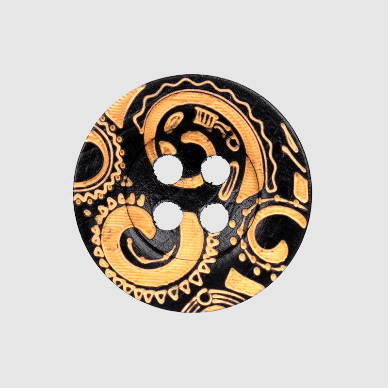 Black round wood button with 4 holes and ornate gold carved vintage pattern