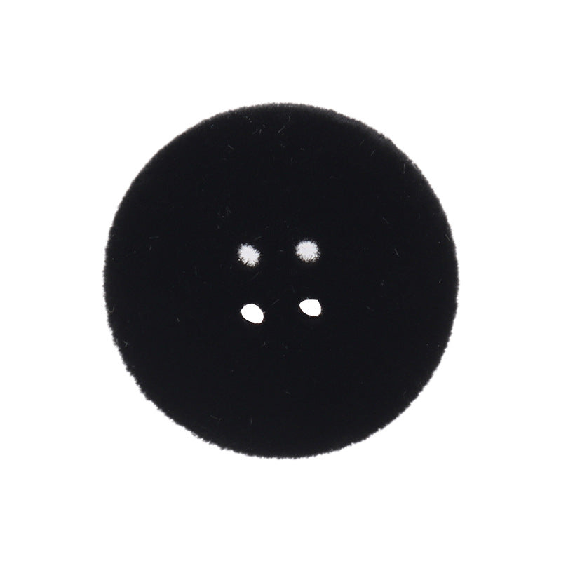 Black flocked flat button with four holes (15–25mm), close-up, front view
