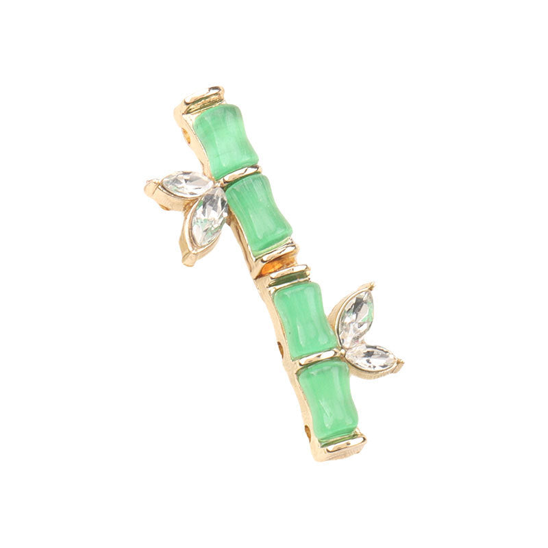 Botón verde estilo bambú con pedrería tipo diamante, resina y metal, 31mm
