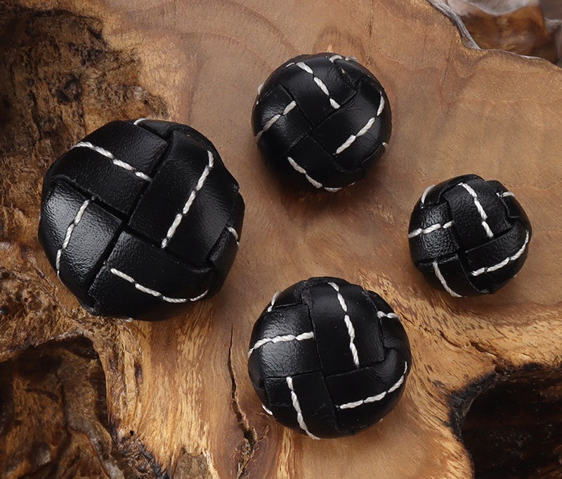 Black genuine leather football buttons with white stitched seams, 4-piece view