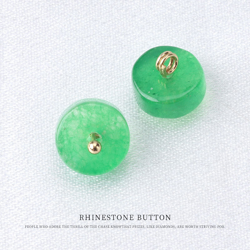 Green natural jade button pair with metal loop backs and round stud fronts