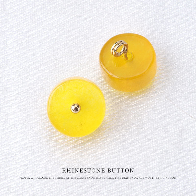 Yellow natural jade buttons with metal loop backs and circular metal stud fronts