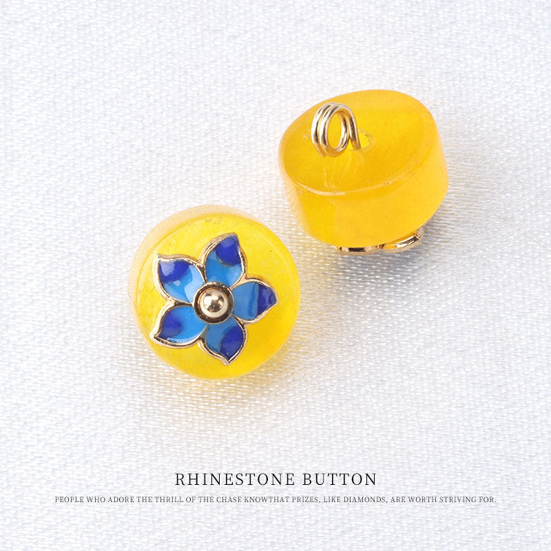 Yellow natural jade buttons with blue flower mounts and metal loop backs