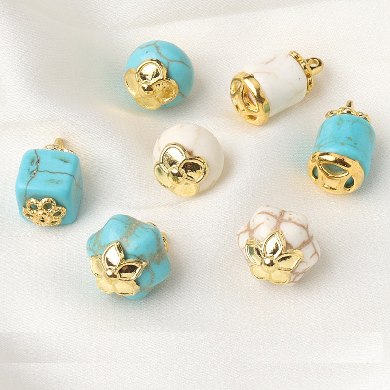 Assorted white and blue resin flower mount buttons with gold flower settings, mixed shapes