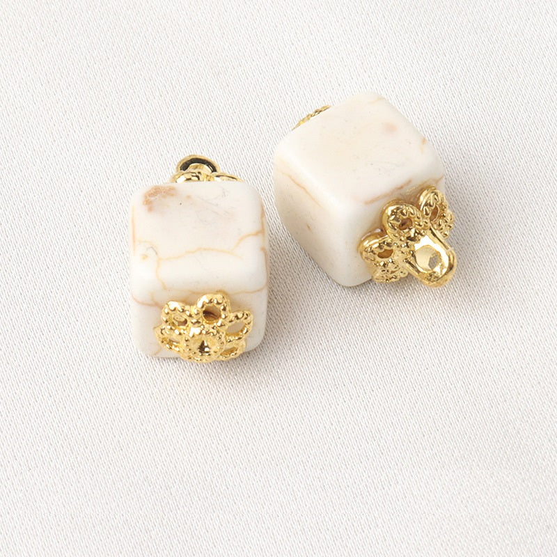 White resin flower mount buttons, square shape with gold shank and floral settings