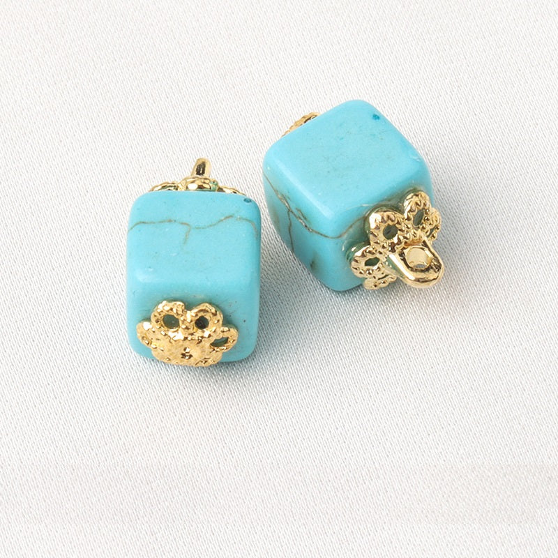 Blue resin flower mount buttons, square shape with gold shank and flower detail