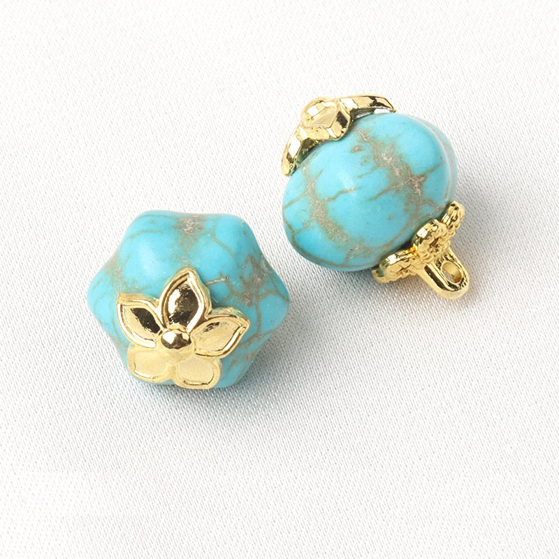 Blue resin flower mount buttons, hexahedral shapes with gold flower settings and shanks