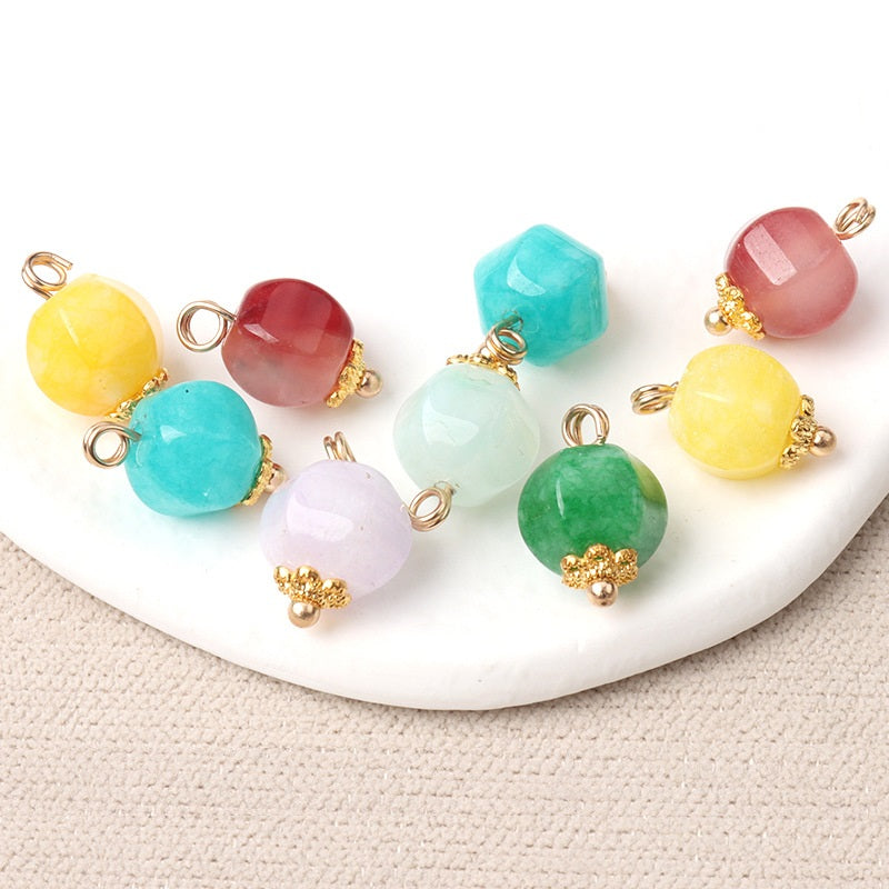 Colorful 11mm jade polyhedron buttons with gold flower settings, pearl center accents