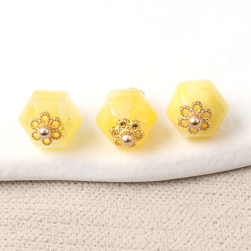 Light yellow 11mm jade polyhedron buttons with gold flower filigree and silver pearl centers