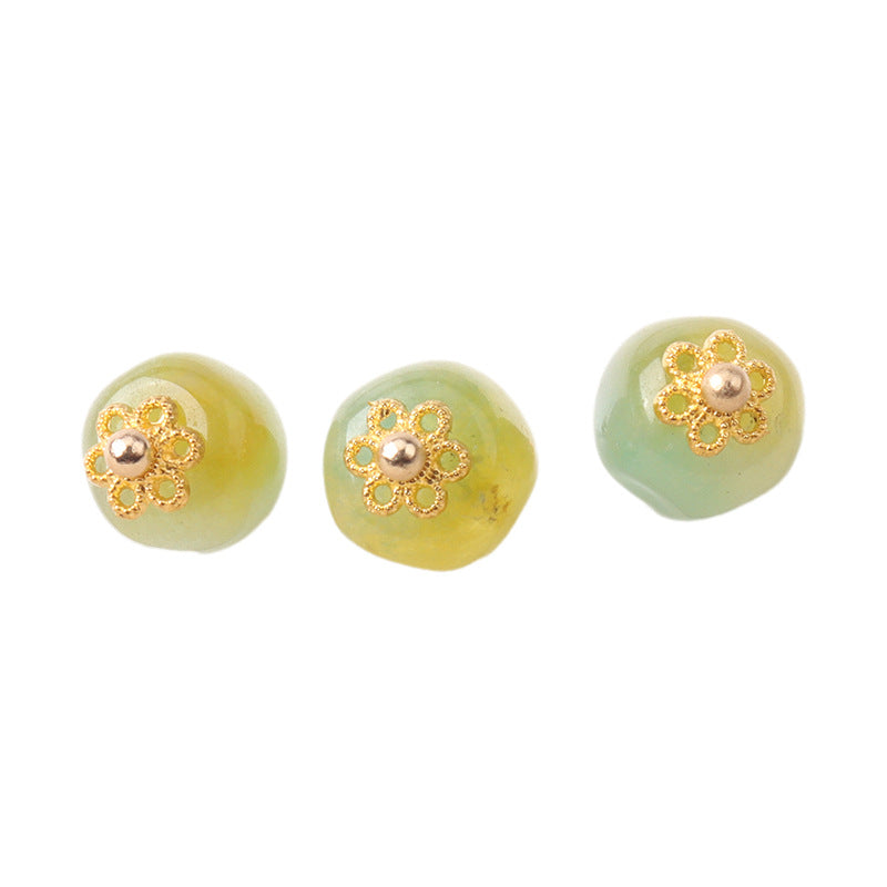 Light green jade bead button, gold flower mount with small metal bead center