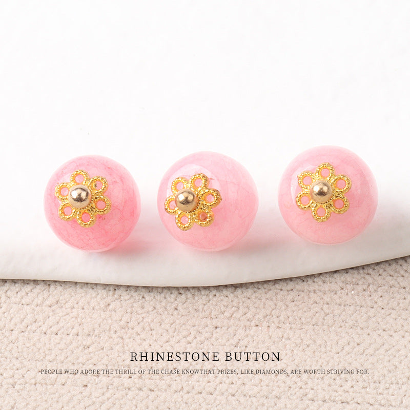 Pink jade bead buttons with gold flower mounts and small round metal bead centers