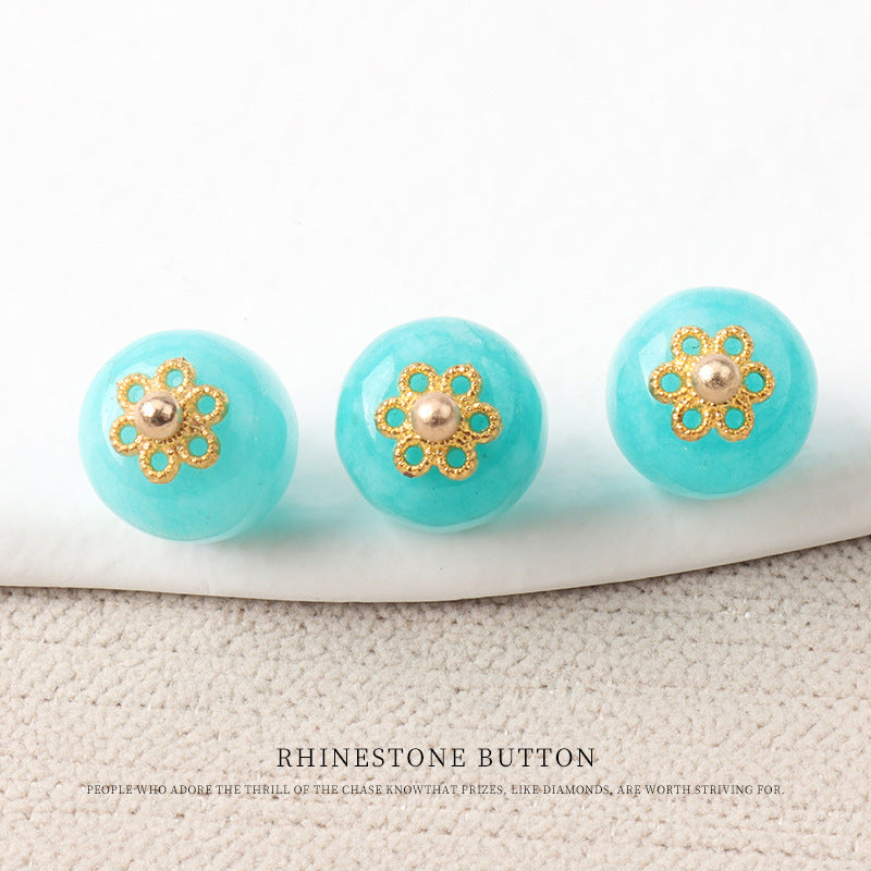 Aqua/teal jade bead buttons with gold flower mounts and round metal bead centers