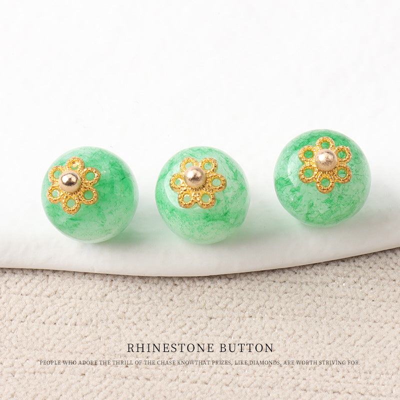 Green jade bead buttons with gold flower mounts and round metal bead centers