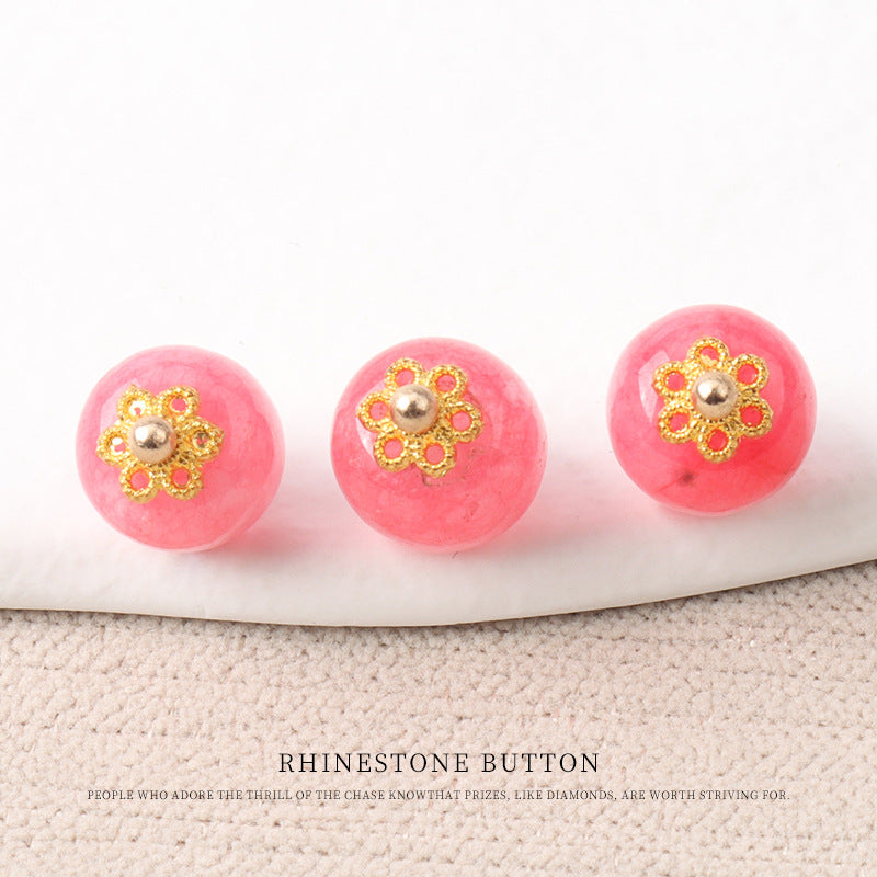 Bright pink jade bead buttons with gold flower mounts and round metal bead centers
