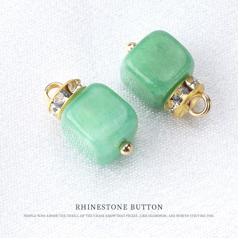 Green natural stone frog knot button with gold tone loop and rhinestone accents