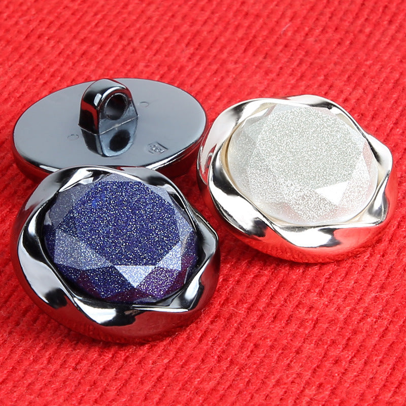 Pair: round pearlescent plastic button with shank, blue and white/silver fronts, backs