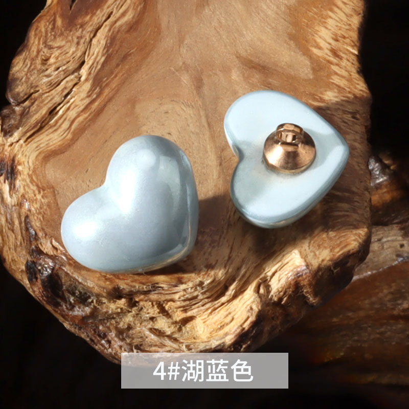 14mm heart-shaped plastic decorative button in light blue with metal shank