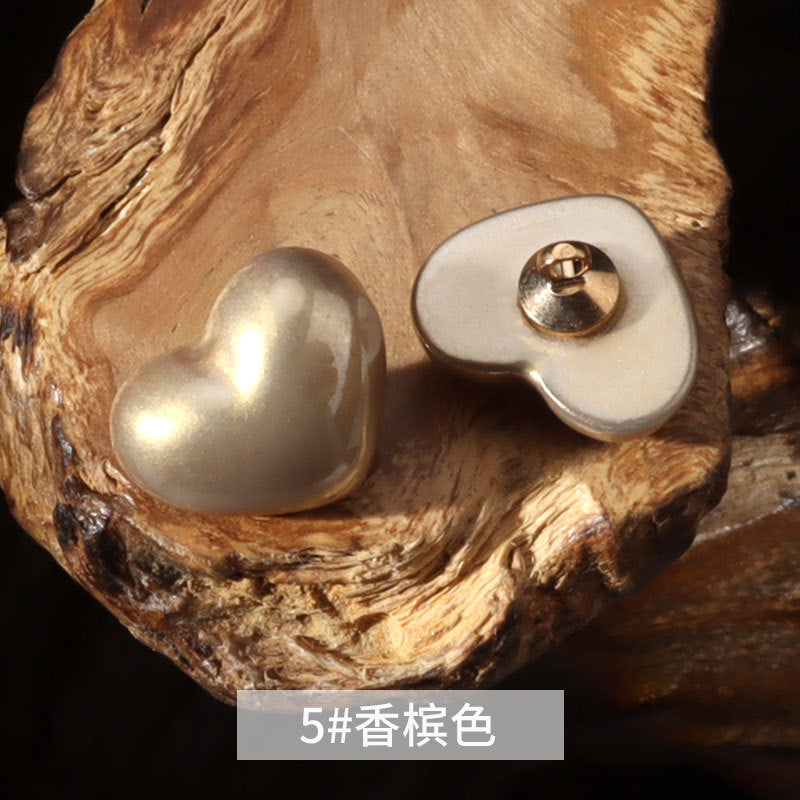 14mm heart-shaped plastic decorative button in warm beige with metal shank
