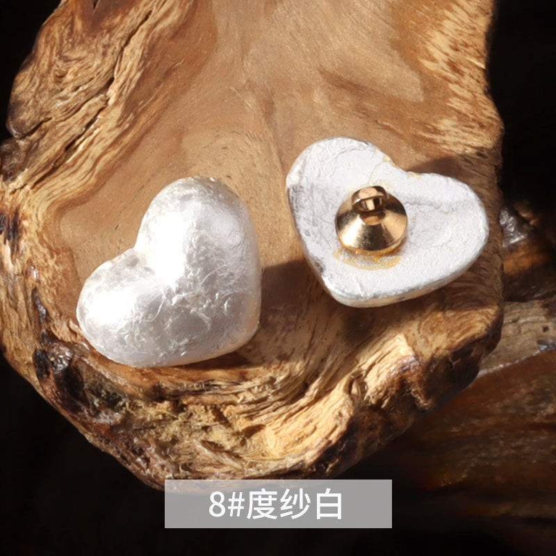 14mm heart-shaped plastic decorative button in textured white with metal shank