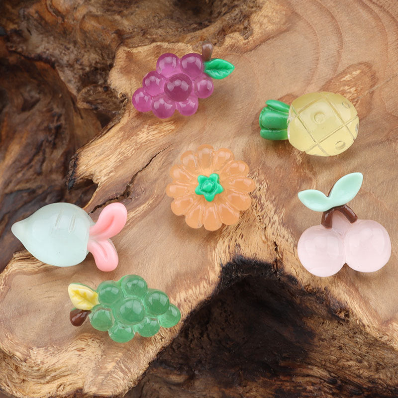 Colorful kids plastic buttons: purple flower, pineapple, orange flower, cherries, green fruit