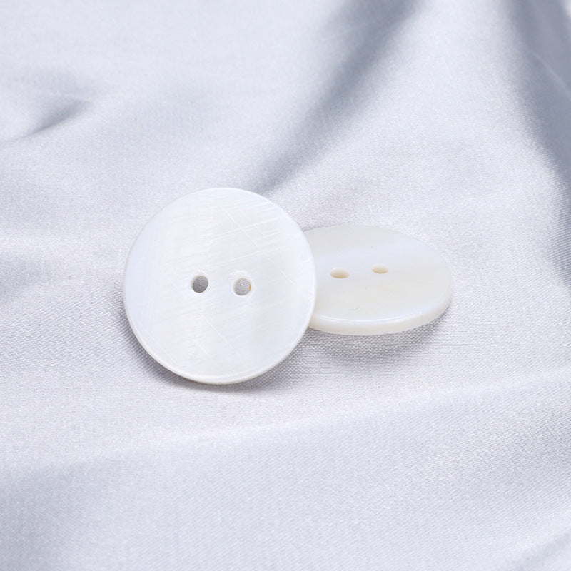 White two-hole shell button set, front and back