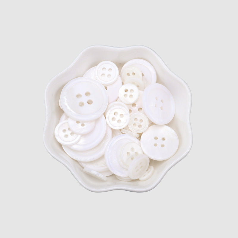 Bag of white 4-hole round shell buttons, 90-pack