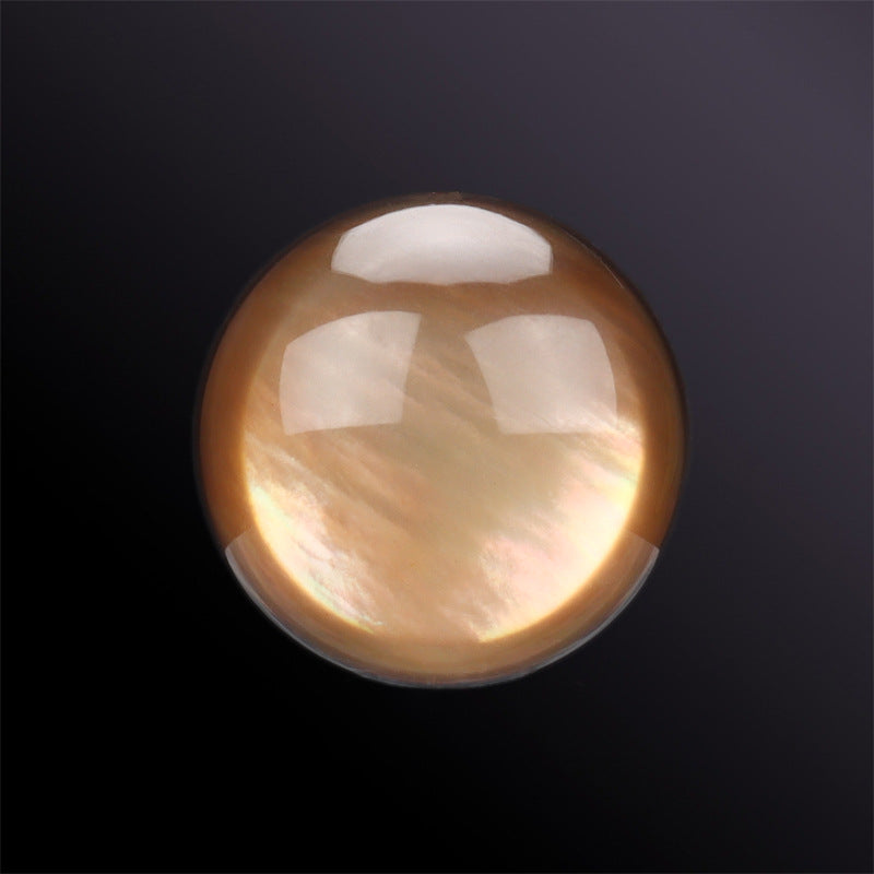 Coffee-brown hemispherical shell button, glossy iridescent finish, close-up