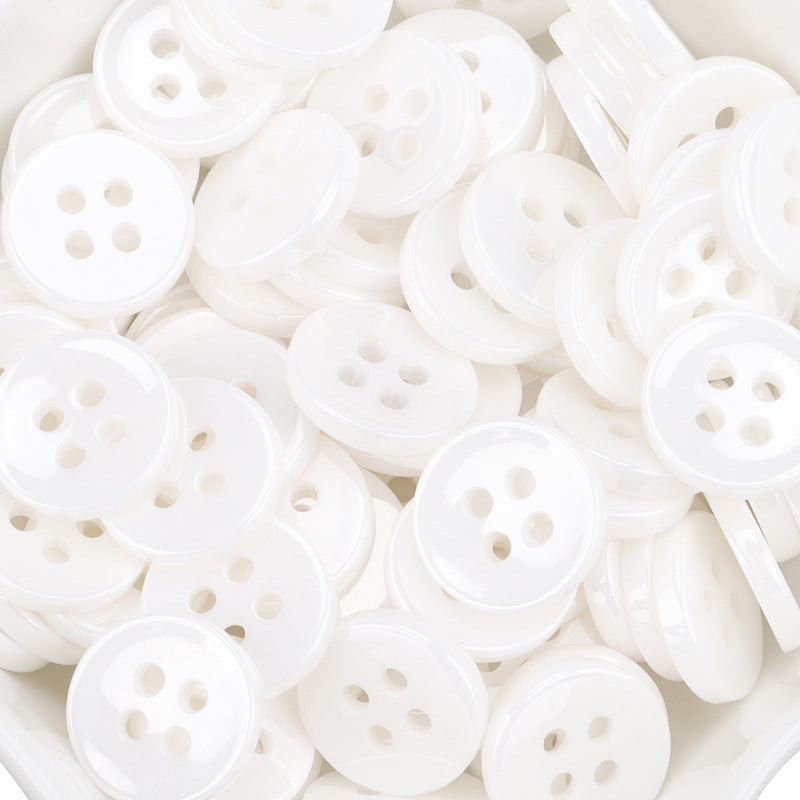 Mixed view of white ceramic buttons with 4 holes and back sides