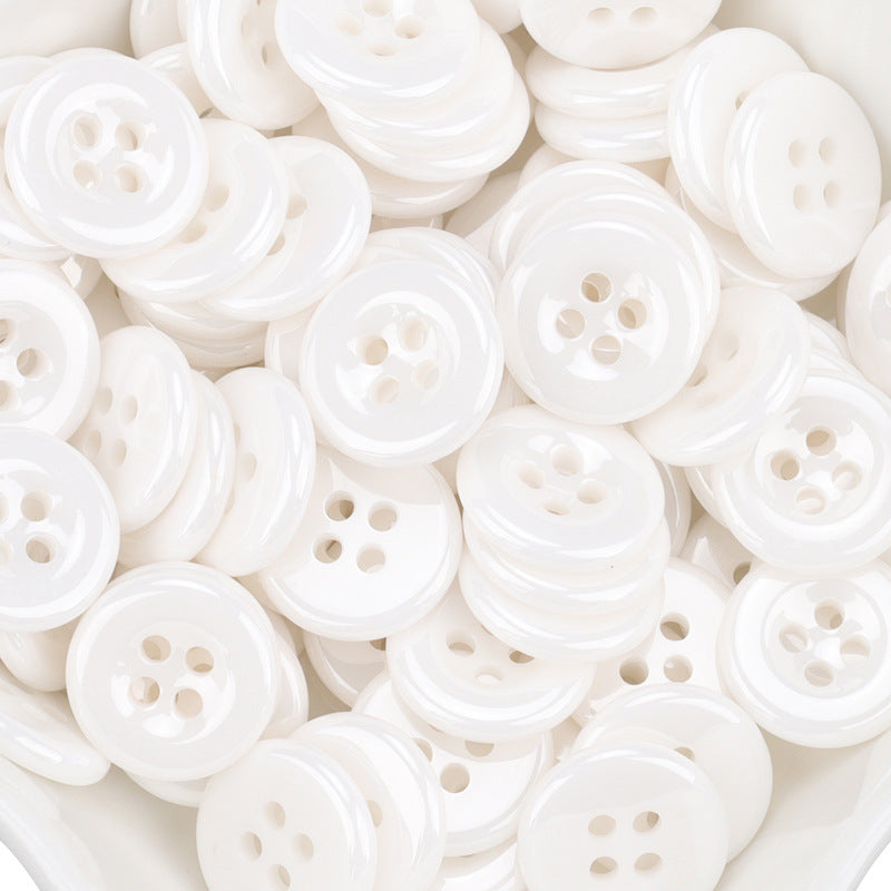 White ceramic shirt buttons, 11.5mm, four-hole front view (55 pack)