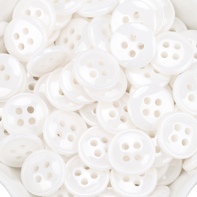 White ceramic shirt buttons, 4-hole fronts, tightly packed assortment