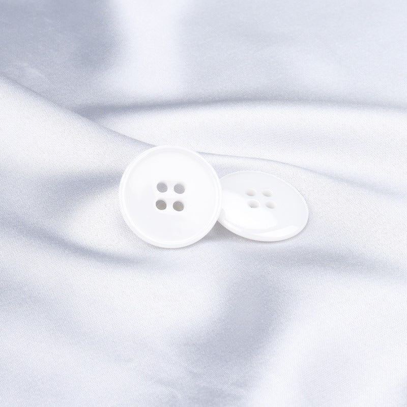 15mm/20mm white ceramic suit buttons with 4 holes, two-button view on fabric