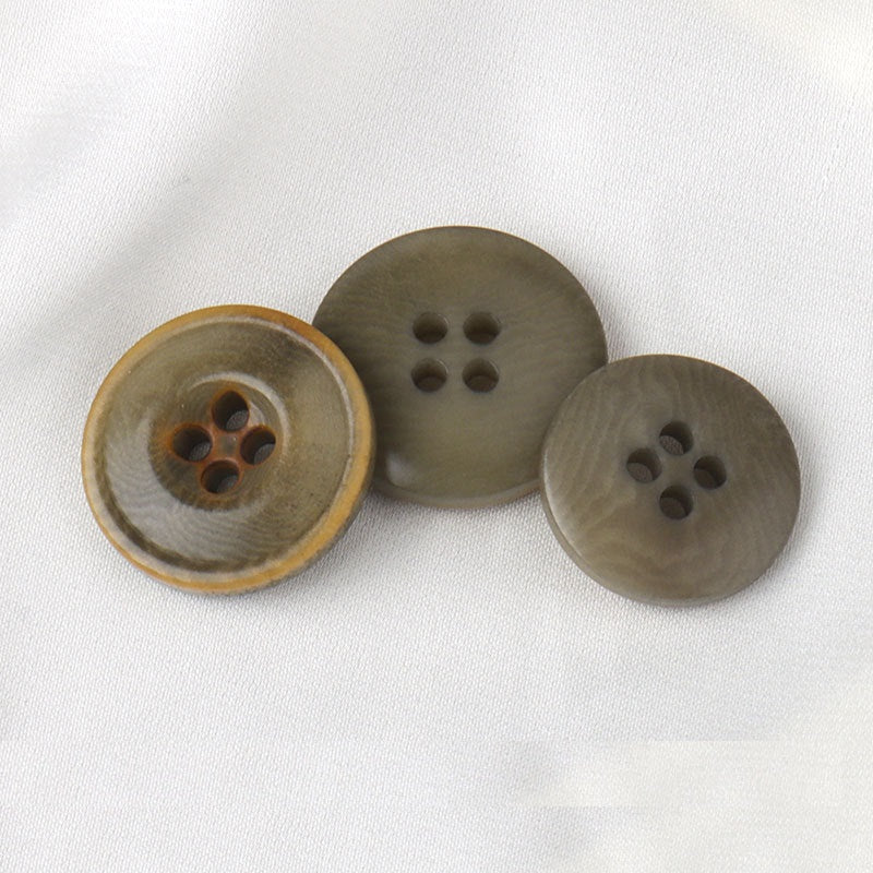 Three palm nut buttons, round 4-hole fronts and backs
