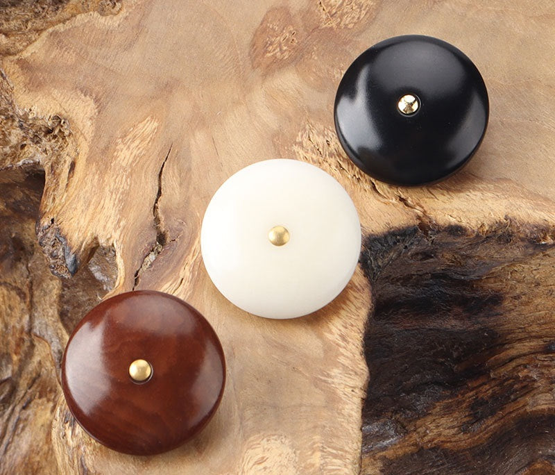 Corozo shank buttons: white, brown, and black round fronts with brass shanks