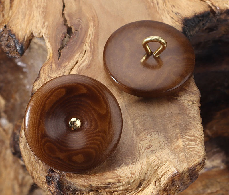 Coffee-brown and darker brown corozo buttons with gold-toned loop shanks