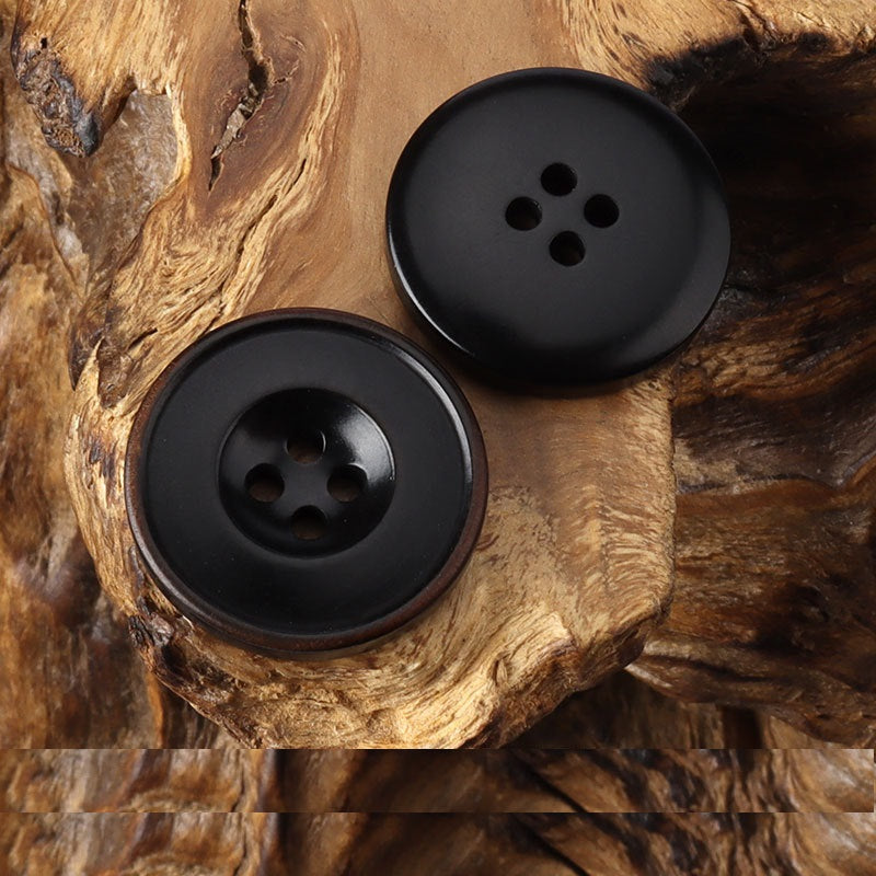Round 4-hole buttons, black with smooth face and brown burnished rim