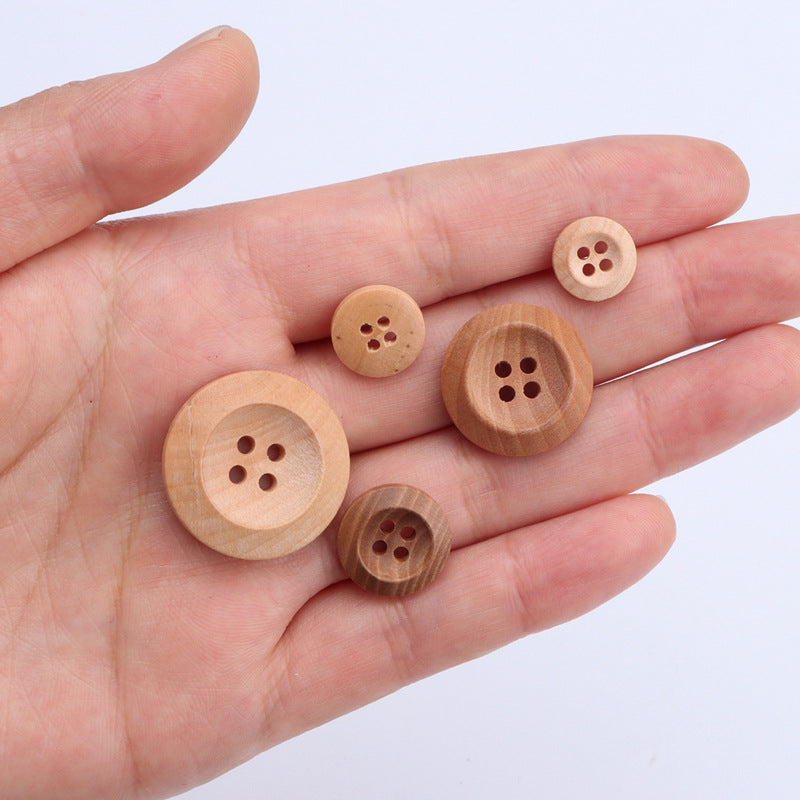 Set of natural wood 4-hole buttons in different light wood tones