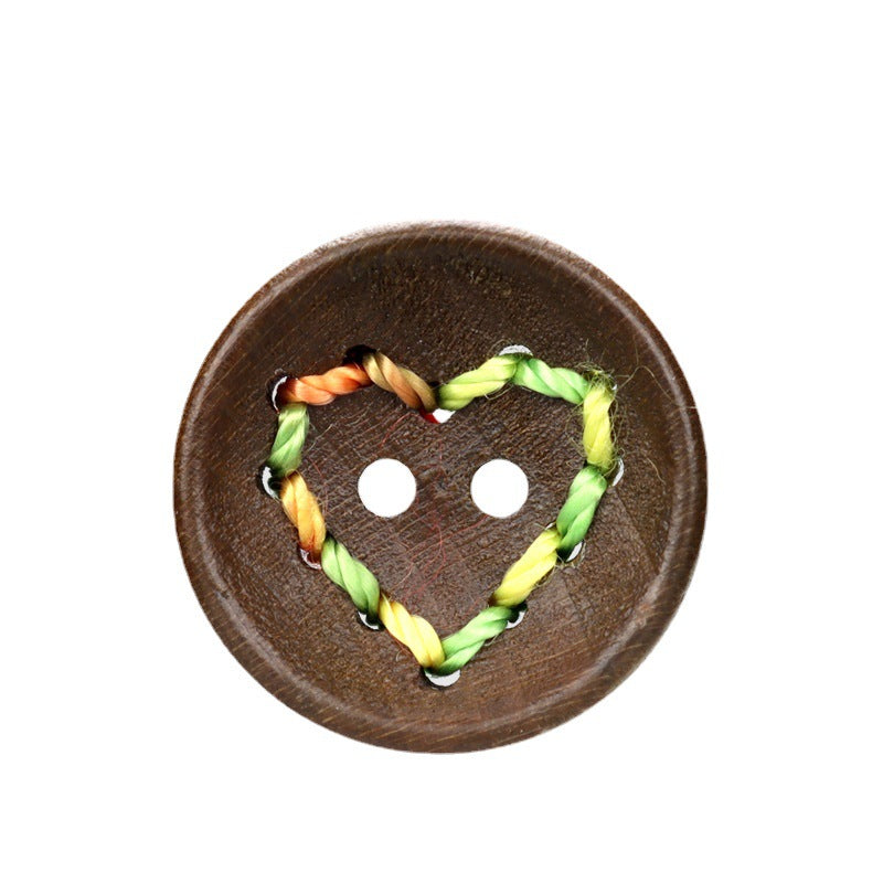 Dark coffee button with heart cutouts, green-yellow stitched thread heart