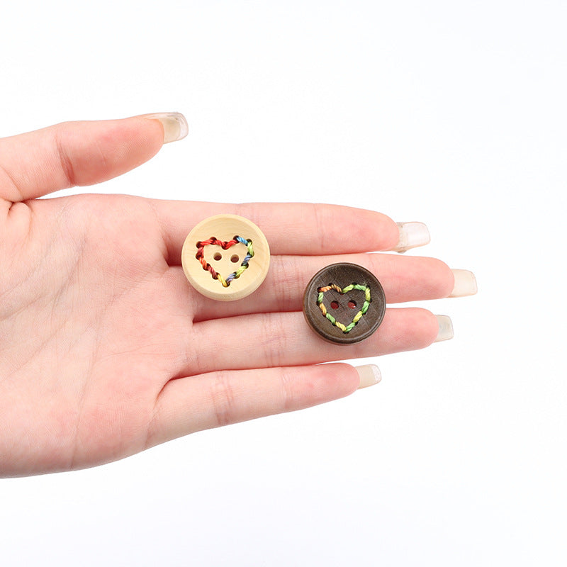 Pair of heart-pattern wooden buttons: light wood and dark coffee, multicolor stitching