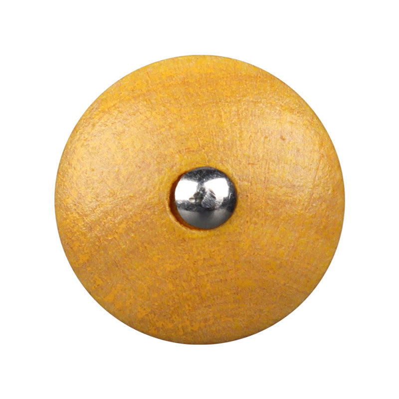 Yellow round natural wood button with metal shank and visible back loop