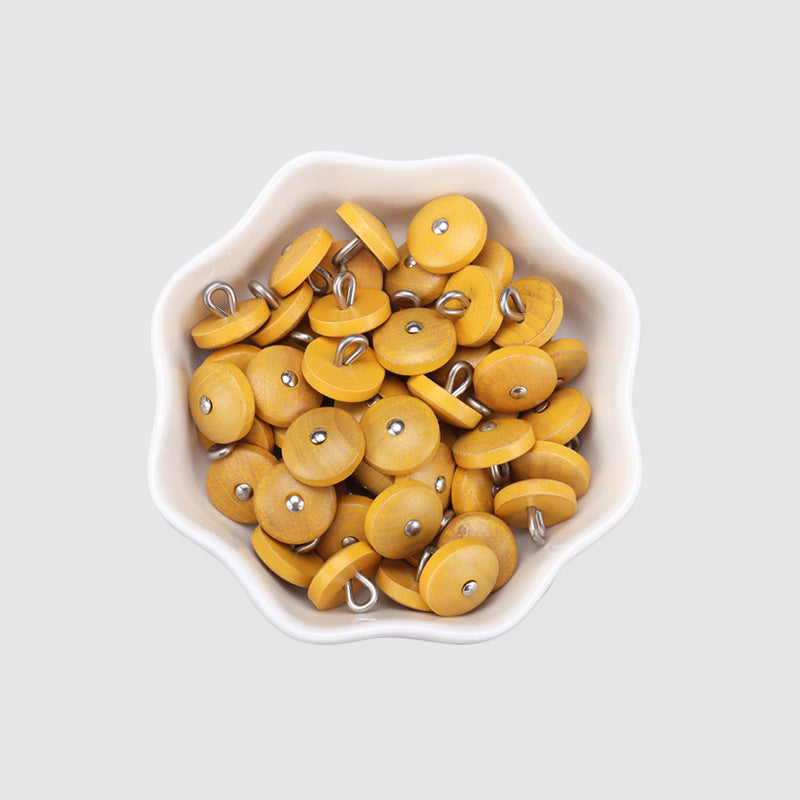 Bowl of round natural wood buttons in yellow with metal shanks, 11.5mm