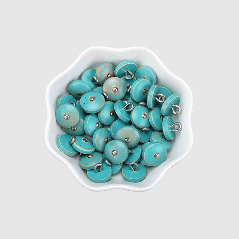 Bowl of round natural wood buttons in blue with metal shanks, 11.5mm