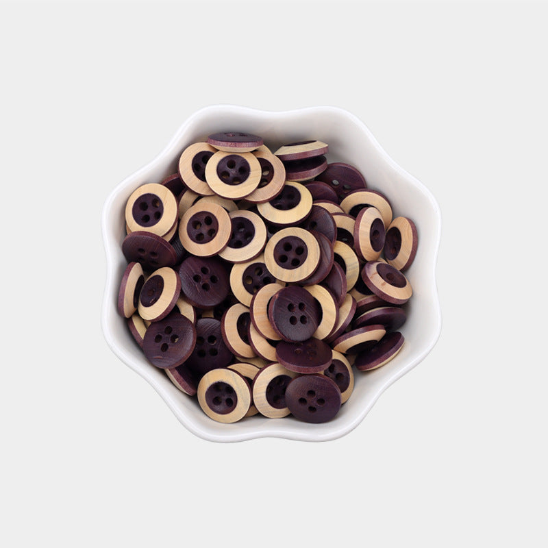 11.5mm round 4-hole baked wood buttons, purple-red with light wood, in bowl