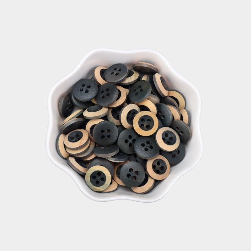 11.5mm round 4-hole baked wood buttons, grey-blue with light wood, in bowl